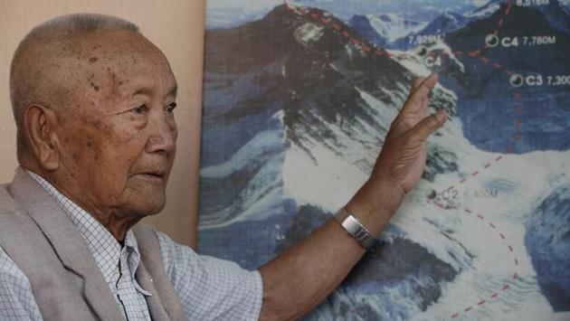 Nepalese climber Min Bahadur Sherchan, points to a picture to describe the trail to Mount Everest. The 85-year-old climber who was once the oldest person to scale the world’s highest mountain is heading back to Mount Everest in hopes of scaling the peak and regaining the title. Sherchan is aiming to scale the peak next month when there is window of favourable weather on the summit. (Niranjan Shrestha/AP)