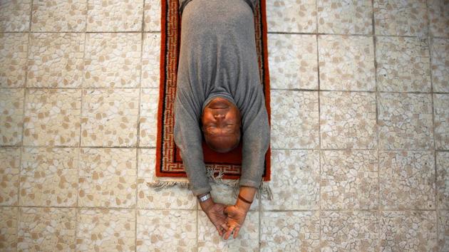 Nepali mountain climber Min Bahadur Sherchan, 85, who will attempt to climb Everest to become the oldest person to conquer the world's highest mountain, performs yoga at his house in Kathmandu, Nepal. (Navesh Chitrakar/REUTERS)