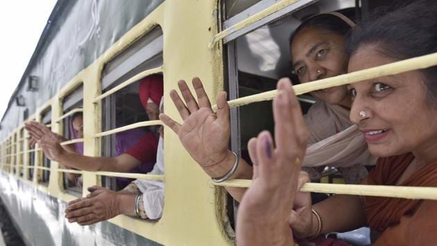 Pilgrims leaving for Pakistan on a special train from Attari station on Wednesday. Sikh jathas (groups) are going to celebrate Baisakhi and pay obeisance at gurdwaras across the border. (Gurpreet Singh/HT)