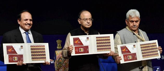 New Delhi: Finance Minister Arun Jaitley along with Telecom Minister Manoj Sinha and Secretary of Post AP Singh releasing commemorative stamp during the launch of pilot branches of India Post Payments in New Delhi on Monday. (PTI) New Delhi: Finance Minister Arun Jaitley along with Telecom Minister Manoj Sinha and Secretary of Post AP Singh releasing commemorative stamp during the launch of pilot branches of India Post Payments in New Delhi on Monday. (PTI)