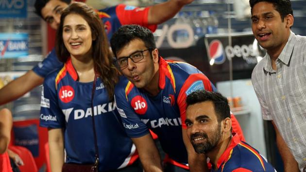 Actor Sagarika Ghatge (left) with captain Zaheer Khan (right) at the Delhi Daredevils dugout after their 2017 Indian Premier League match against Rising Pune Supergiant in Pune on Tuesday.(BCCI)