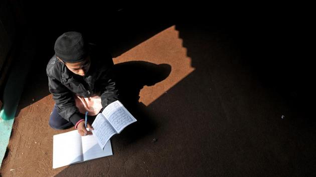 A Rohingya Muslim boy studies at a Madrasa at a refugee camp. The attack on a Rohingya Muslim on Monday amid threats by pro-Jammu outfits brings to fore the pent-up anger against the migrant community from Myanmar that has taken shelter in the Hindu-dominated city. (Nitin Kanotra/HT Photo)