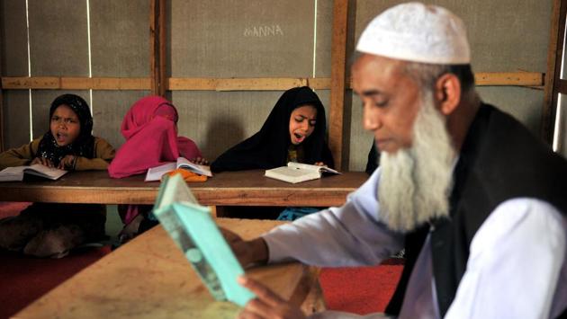 Rohingya Muslim girls study at a Madrasa in the refugee camp. On Monday evening, five masked men abused and assaulted Karim Ullah, 38, in the slum at Bohri, where 50-odd Rohingya families are settled. Police registered a first information report against the attackers but added that one migrant was targeted and there was no damage to property. (Nitin Kanotra/HT Photo)