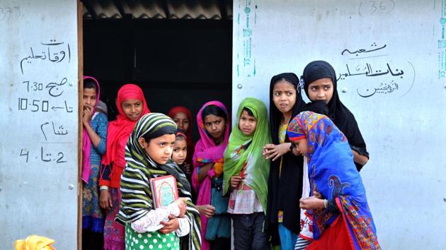 Rohingya Muslim girls wait for their teacher outside the Madrasa. The attack comes three days after the Jammu Chamber of Commerce and Industry (JCCI) issued a statement, announcing that it will “identify and kill” Rohingyas in Jammu if the government fails to deport them to Myanmar and Bangladesh within a month. (Nitin Kanotra/HT Photo)