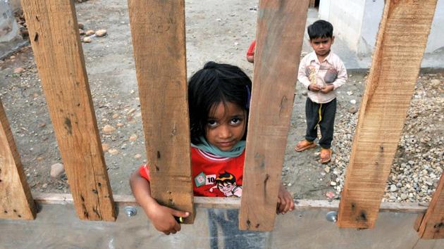 A Rohingya Muslim girl reacts to camera at a refugee camp. Being a Muslim majority state, the Rohingyas were brought by their guides to settle down in J&K more than 15 years ago. (Nitin Kanotra/HT Photo)