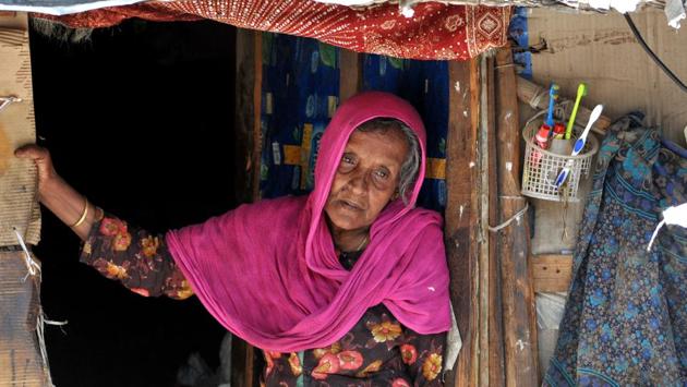 An old Rohingya Muslim woman stands at the entrance of her temporary shed at a refugee camp. Bathindi Ka Plot is home to the highest number of Rohingya migrants — 686 in all. (Nitin Kanotra/HT Photo)