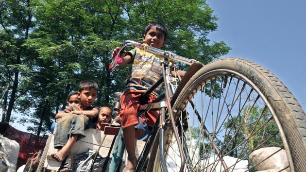Rohingya Muslim children playing on a cart at a refugee camp on the outskirts of Jammu. Security forces see the Rohingya population as a potential threat in the militancy-hit state close to a hostile neighbour. (Nitin Kanotra/HT Photo)