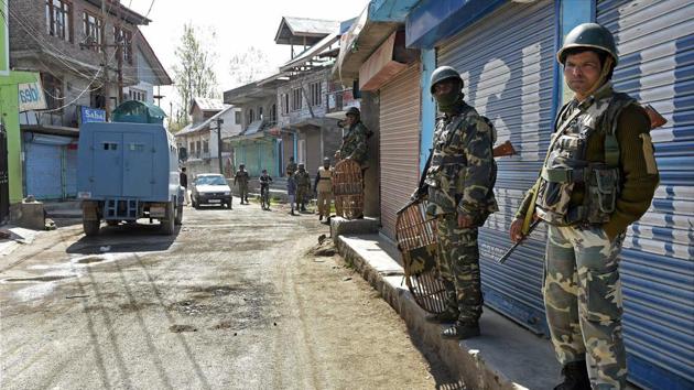 CRPF personnel maintain vigil during repoll in Srinagar Lok Sabha constituency in Budgam district of Kashmir on Thursday.(PTI)