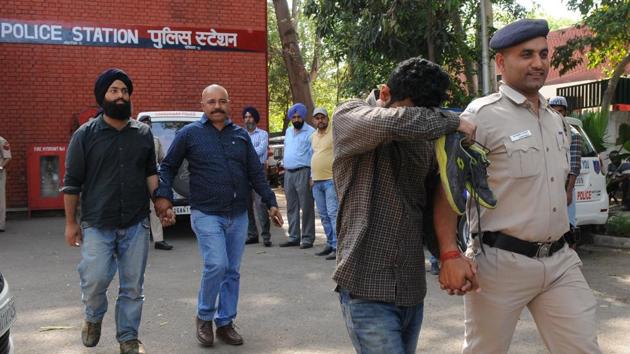 Students for Society (SFS) leader Amritpal Singh (left) and others being taken from Sector-11 police station to court on Wednesday. Singh contested PU student council elections in 2016.(Anil Dayal/HT Photo)