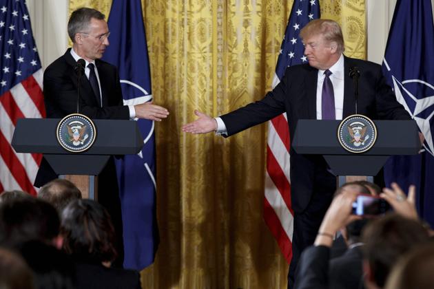 Trump shakes hands with Nato secretary general Jens Stoltenberg at the White House on Wednesday. (AP) Trump shakes hands with Nato secretary general Jens Stoltenberg at the White House on Wednesday. (AP)