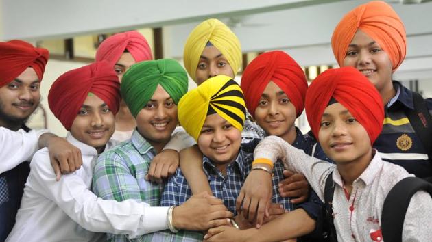Sikh boys posing for a group photograph after participating in a turban tying competition held at Sarabha Nagar gurdwara on the occasion of Baisakhi in Ludhiana. (Gurminder Singh/HT Photo)