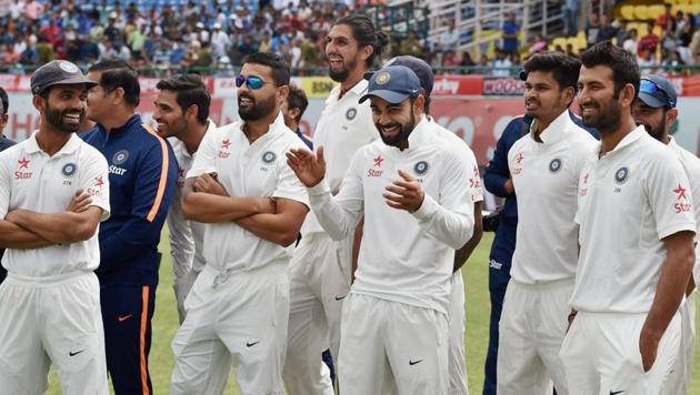 India captain Virat Kohli with teammates at the presentation ceremony after winning the four-match Test series against Australia at HPCA Stadium in Dharamsala on Tuesday.(PTI)