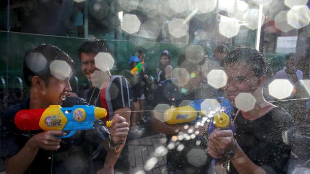 Revellers take part in a water fight at Songkran Festival marking the Thai new year celebrations in Bangkok streets on April 13, 2017. April being the hottest month of the year sees the entire country go bananas in friendly water fights and street parties that last nearly a week. (REUTERS)