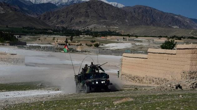 Afghan security forces take part in an ongoing operation against Islamic State (IS) militants in the Achin district of Afghanistan's Nangarhar province on April 14, 2017, a day after the US military struck the district with its largest non-nuclear bomb.(AFP)