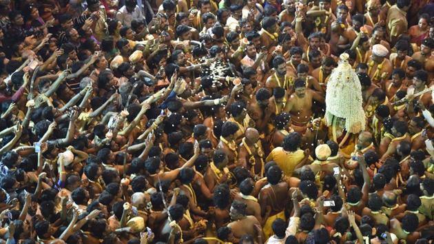 Crowds chanting as Karaga comes out from the temple on the occasion of Karaga at Dharmaraya Swamy Temple in Bengaluru. (Arijit Sen/HT Photo) Crowds chanting as Karaga comes out from the temple on the occasion of Karaga at Dharmaraya Swamy Temple in Bengaluru. (Arijit Sen/HT Photo)