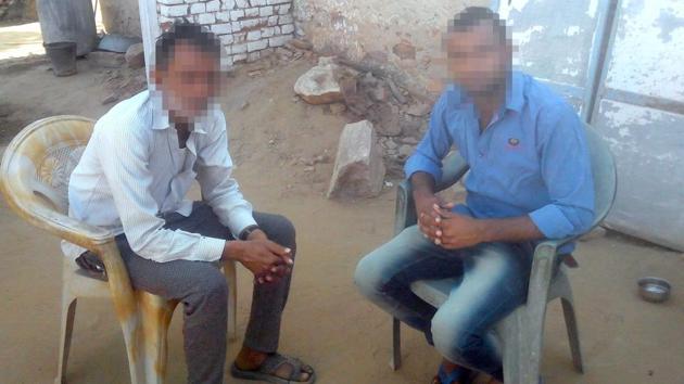 The father and brother of the girls who committed suicide on the day they were allegedly assaulted at their village in Sikar district, Rajasthan.(HT Photo)
