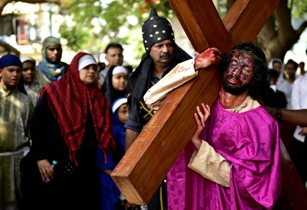 An artist enacts the crucifixion of Jesus on the occasion of Good Friday at Our Lady Lourdes Church at Cambridge Layout in Bengaluru, India. (Arijit Sen/HT Photo)