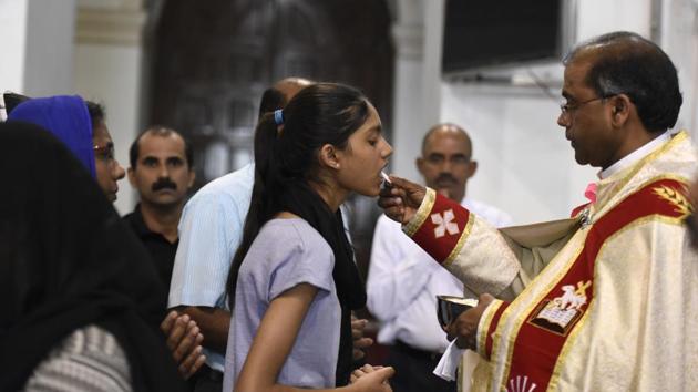 The Holy Communion is organised at several places. A bitter drink is prepared from mostly leaves and vinegar, which is tasted by all after the service. (Saumya Khandelwal/HT PHOTO)