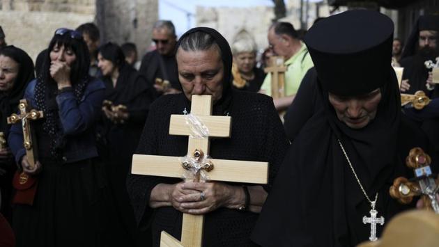 Christian pilgrims attend Good Friday procession in Jerusalem. Good Friday is a Christian holiday which marks the crucifixion of Jesus Christ and his death. (Dan Baliltyl/AP)