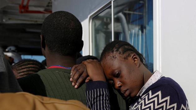 A migrant leans on a peer on the Malta-based NGO Migrant Offshore Aid Station (MOAS) ship Phoenix after being rescued. (Darrin Zammit Lupi / Reuters) A migrant leans on a peer on the Malta-based NGO Migrant Offshore Aid Station (MOAS) ship Phoenix after being rescued. (Darrin Zammit Lupi / Reuters)