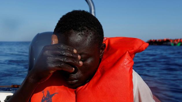 A migrant reacts after being pulled out of the sea after falling off a rubber dinghy. (Darrin Zammit Lupi / Reuters) A migrant reacts after being pulled out of the sea after falling off a rubber dinghy. (Darrin Zammit Lupi / Reuters)