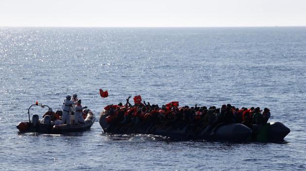 Rescuers of the Malta-based NGO Migrant Offshore Aid Station (MOAS) distribute life jackets to migrants. (Darrin Zammit Lupi / Reuters) Rescuers of the Malta-based NGO Migrant Offshore Aid Station (MOAS) distribute life jackets to migrants. (Darrin Zammit Lupi / Reuters)