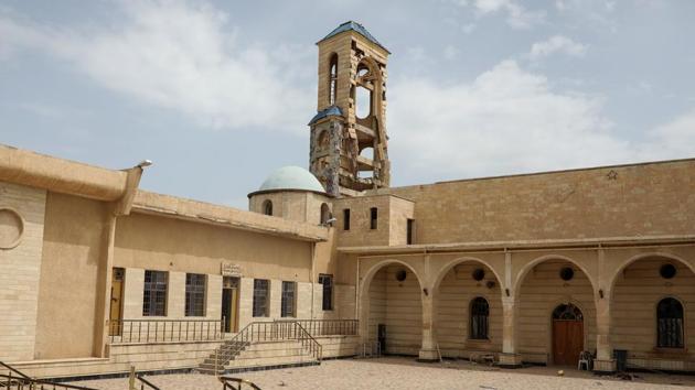 A church that was damaged by Islamic State militants. Those families who have returned to Qaraqosh - once home to 50,000 people - are trying to revive Christian life dating back two millennia. However, most stay only two or three days at a time to refurbish their looted and burnt homes. (Marko Djurica/Reuters)