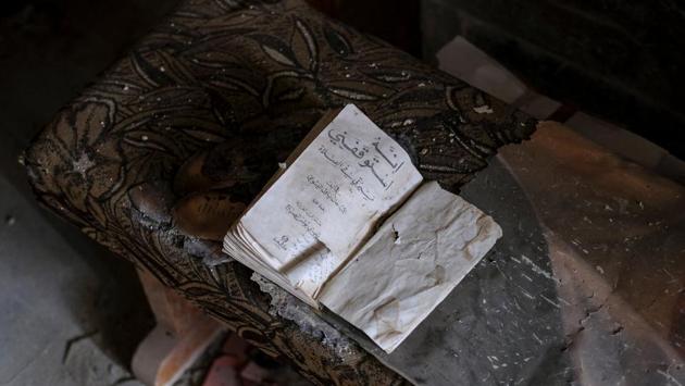 A religious book is seen inside a church. By contrast, displaced Muslims have been flocking back to markets in eastern Mosul since Islamic State’s ejection from that part of the city, despite the battle raging in the Old City across the Tigris River which is the militants’ last stronghold. (Marko Djurica/Reuters)