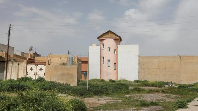 An empty house stands in the town of Qaraqosh. Many Baghdad residents who could not afford to go abroad went to Qaraqosh and other northern towns where security used to be better than in the capital, rocked by sectarian warfare after the U.S.-led invasion. But with the arrival of Islamic State, residents abandoned their homes with some applying for asylum in Europe. (Marko Djurica/Reuters)