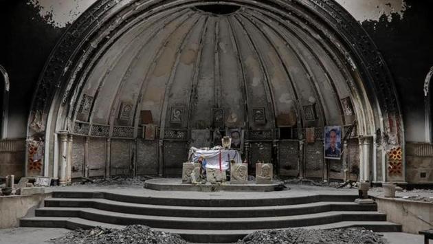 An altar of a damaged church is seen in the town of Qaraqosh, south of Mosul, Iraq. With Islamic State expelled, Iraqi Christians are trickling back to the ransacked town of Qaraqosh, beset by anxiety for their security and yet hopeful they can live in friendship with Muslims of all persuasions. (Marko Djurica/Reuters)