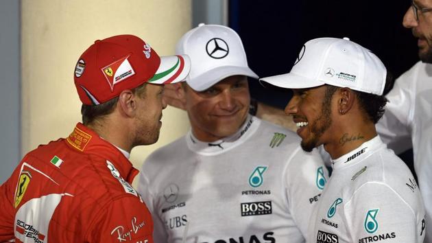 Mercedes' Lewis Hamilton (right) and Valtteri Bottas talks to Ferrari’s Sebastian Vettel after the Bahrain Grand Prix qualifying. (AFP) Mercedes' Lewis Hamilton (right) and Valtteri Bottas talks to Ferrari’s Sebastian Vettel after the Bahrain Grand Prix qualifying. (AFP)