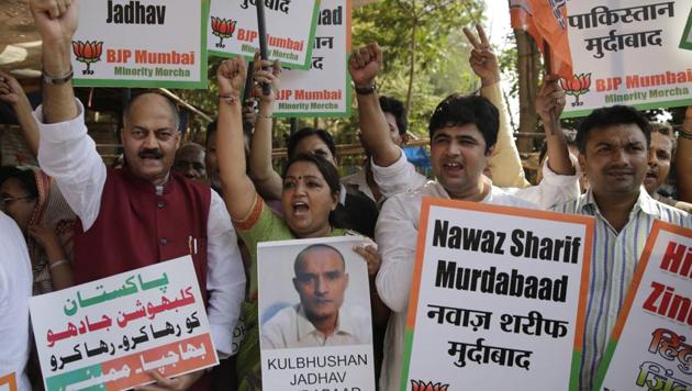 People shout slogans during a protest against the conviction of Kulbhushan Jadhav, in Mumbai. (AP Photo) People shout slogans during a protest against the conviction of Kulbhushan Jadhav, in Mumbai. (AP Photo)