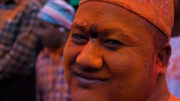 A local’s face is covered in colourful powder as they mark the beginning of new yera. (Photo By Nipun Prabhakar)