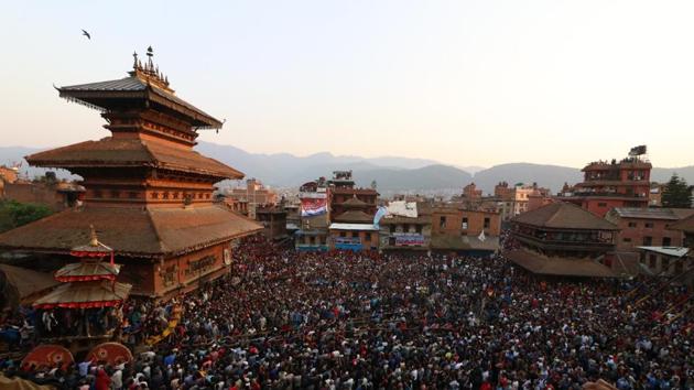 Local people observe the chariot procession during a celebration of traditional Bisket Jatra Festival. (Photo By Nipun Prabhakar)
