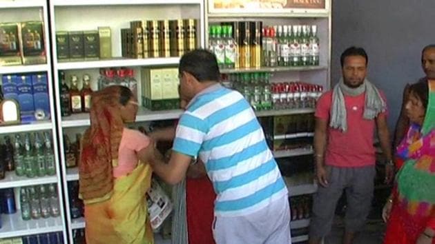 Women of Om Nagar residential colony protest against a liquor shop at Khandsa Road in Gurgaon on Sunday.(HT Photo)