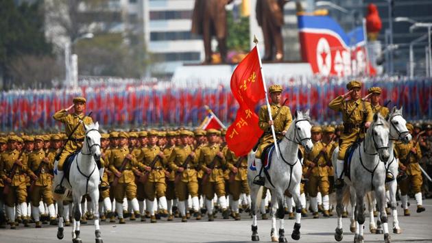 North Korean soldiers, some of them on horses, march during a military parade. (Damir Sagolj / REUTERS)