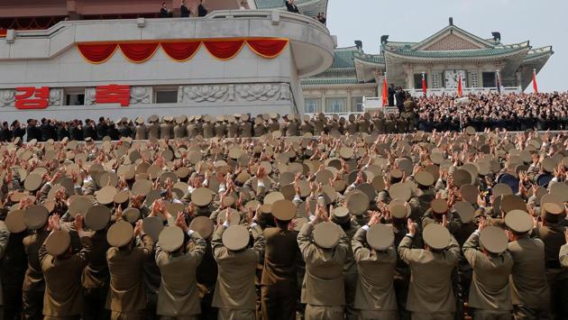 High ranking officers applauds as North Korean leader Kim Jong Un waves to people attending a military parade. (Sue-Lin Wong / REUTERS)