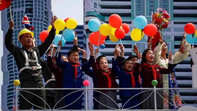 People react as they pass in front of the stand with North Korean leader Kim Jong Un during a military parade marking the 105th birth anniversary of country's founding father Kim Il Sung, in Pyongyang April 15, 2017. (Damir Sagolj / REUTERS)