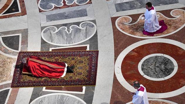 Pope Francis lies as he prays during the Celebration of the Lord's Passion in Saint Peter's Basilica at the Vatican April 14, 2017. (Alberto Pizzoli / REUTERS)
