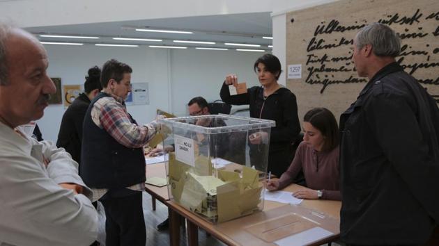 A member of an electoral committee holds a ballot during a counting procedure inside a polling station in Ankara, Turkey, on Sunday, April 16, 2017.(AP Photo) A member of an electoral committee holds a ballot during a counting procedure inside a polling station in Ankara, Turkey, on Sunday, April 16, 2017.(AP Photo)