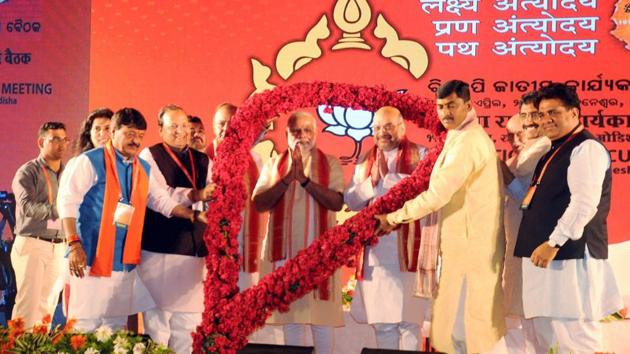 PM Narendra Modi with BJP president Amit Shah at the party's national executive meet in Bhubaneswar. Shah said at the meet that the BJP’s golden era will begin only when it has CMs in every state and holds power from panchayat to Parliament.(PTI)