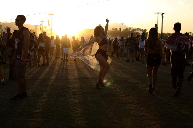 A woman dances at sunset during the Music Festival. (Carlo Allegri / REUTERS)