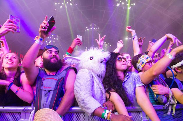 Fans of DJ Khaled dance during his performance at the Coachella Valley Music And Arts Festival. (Valerie Macon / AFP)
