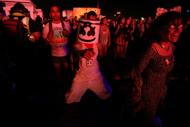 A person dances as Lady Gaga performs during the Festival. (Carlo Allegri / REUTERS)