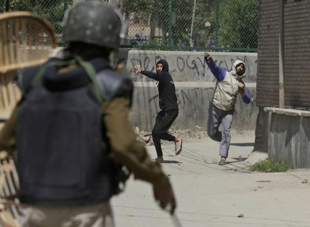 When the security forces asked the protesters to disperse but they did not budge and started pelting stones on the forces, leading to clashes, a police official said. (Tauseef Mustafa / AP)