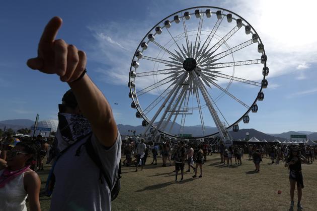 People walk on the grounds during the Festival. (Carlo Allegri / REUTERS)
