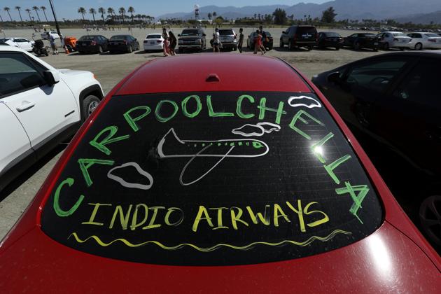 A car with writing on it is pictured in the parking lot on the grounds. (Carlo Allegri / REUTERS)