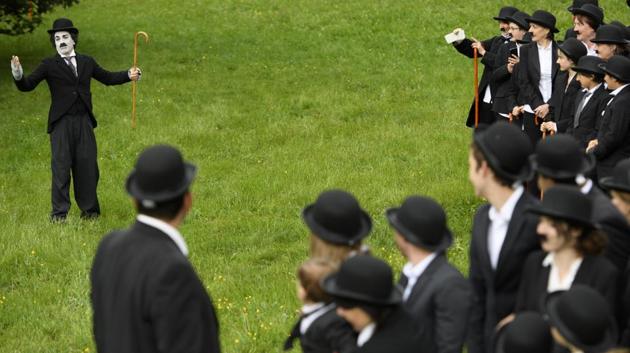 The Chaplin’s World museum, which opened a year ago, said 662 people sporting the star’s distinctive bowler hat and cane gathered Sunday at the Manoir de Ban in Corsier-sur-Vevey, above Lake Geneva. (Laurent Gillieron / AP)