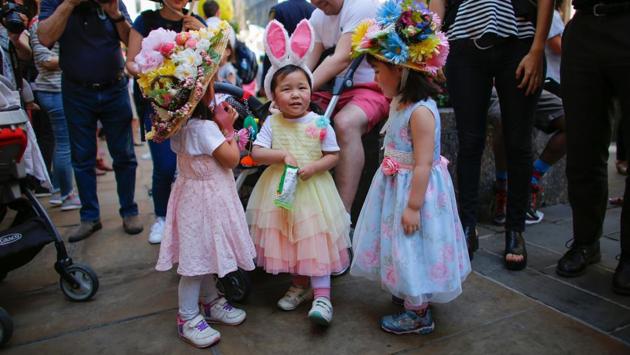Japanese kids eat snacks as they attend the annual Easter Parade . (KENA BETANCUR / AFP) Japanese kids eat snacks as they attend the annual Easter Parade . (KENA BETANCUR / AFP)