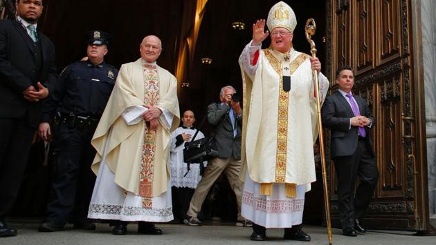 Cardinal Timothy Dolan waves as he leaves St. Patrick's Cathedral during the annual Easter Parade and Easter Bonnet Festival. (KENA BETANCUR / AFP) Cardinal Timothy Dolan waves as he leaves St. Patrick's Cathedral during the annual Easter Parade and Easter Bonnet Festival. (KENA BETANCUR / AFP)
